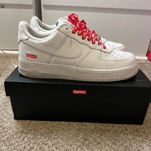 White/Red Nike Supreme Air Force Ones, Size 12. Great Condition worn 4x.